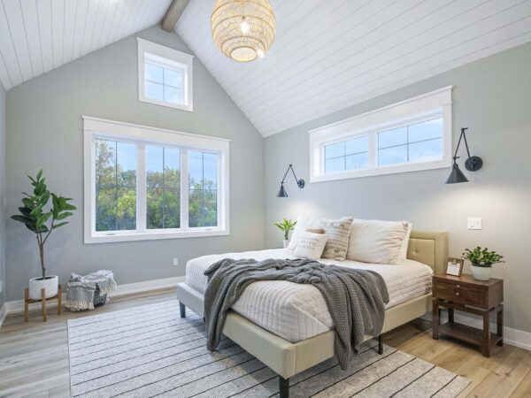 Simple upstairs bedroom remodel of a new home with warm neutral accents