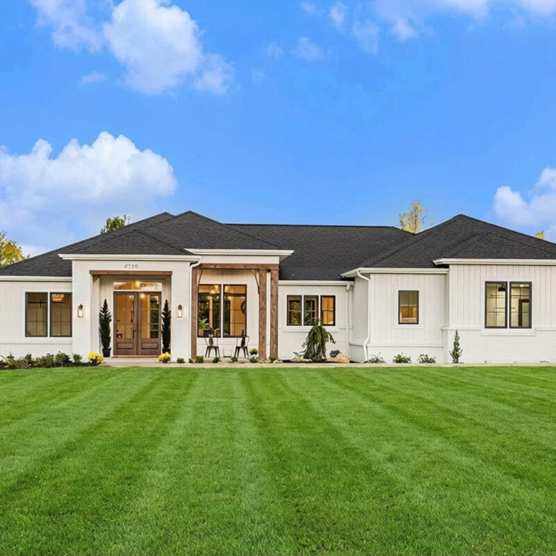 Wide shot of a new cream home built in West Michigan