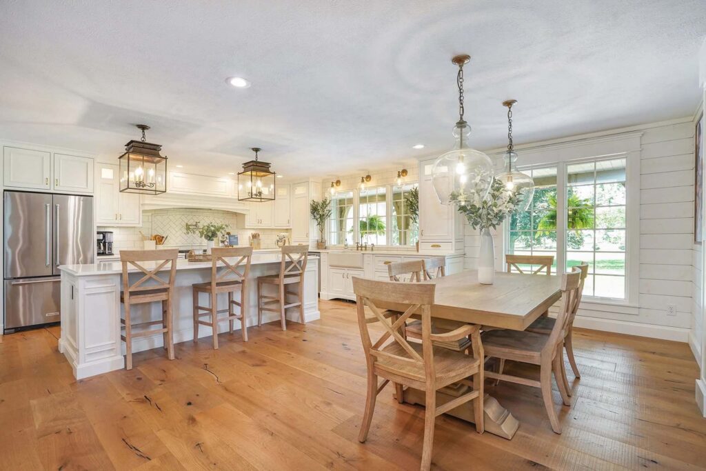 Cottage-core kitchen and dining area with lighter wood and white accents
