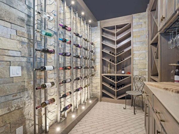 Custom built basement wine cellar featuring masonry brick and tiled floors