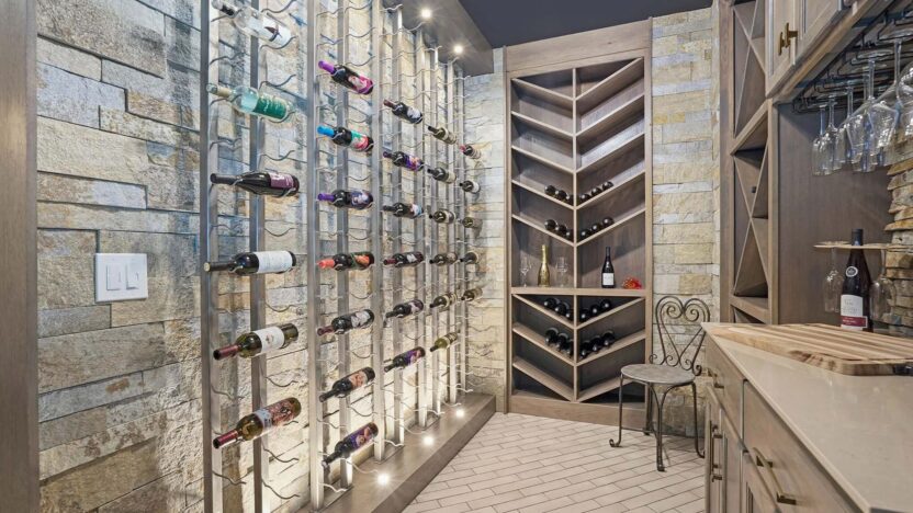 Custom built basement wine cellar featuring masonry brick and tiled floors