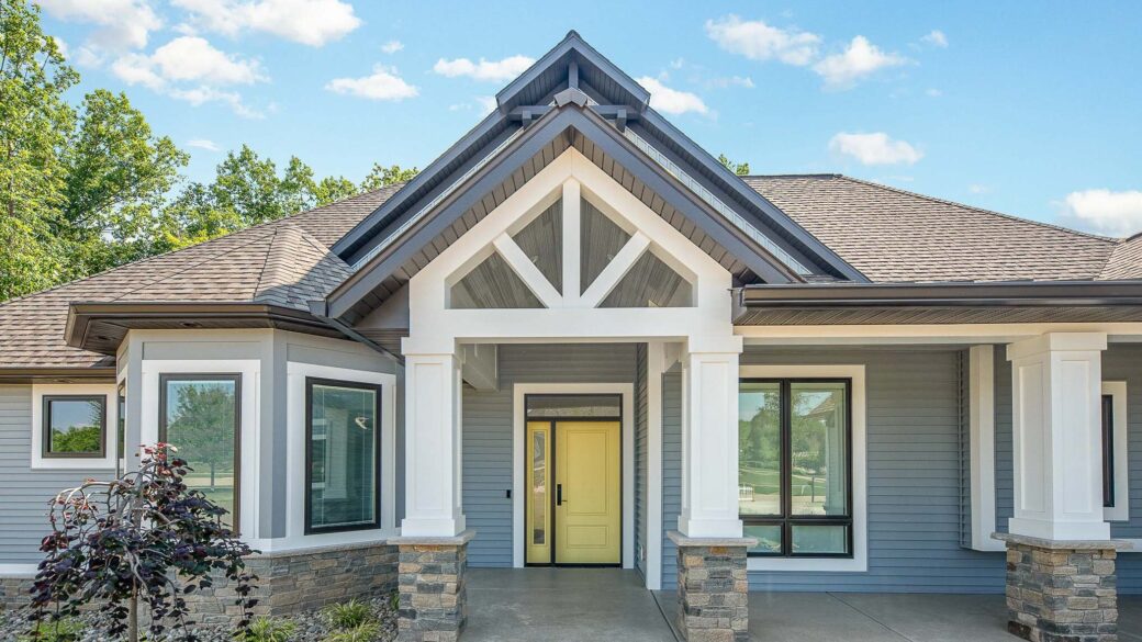 Modern entry way of a custom built grey house