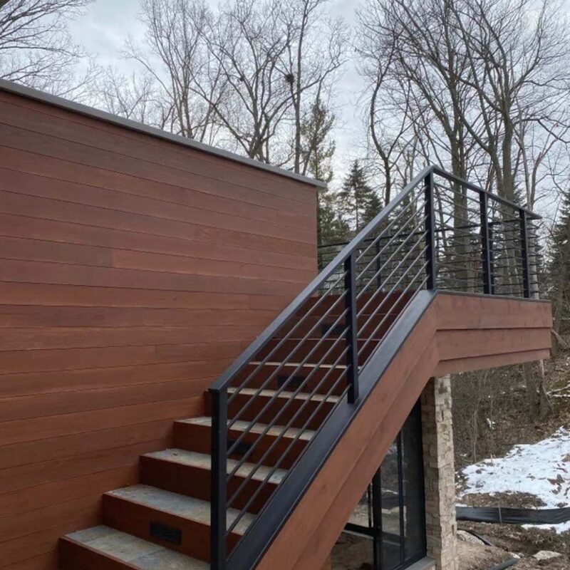 Newly built stairway with modern black railings