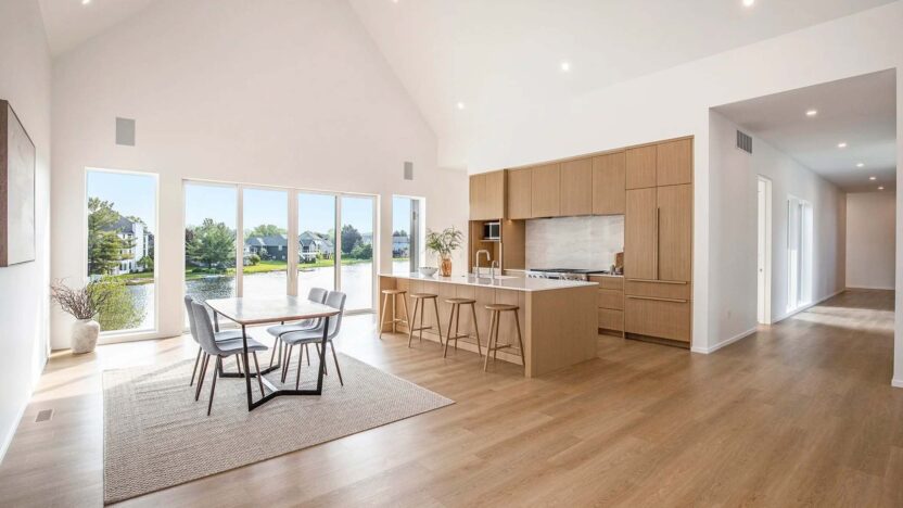 Open kitchen and dining room area of a modern industrial lake house